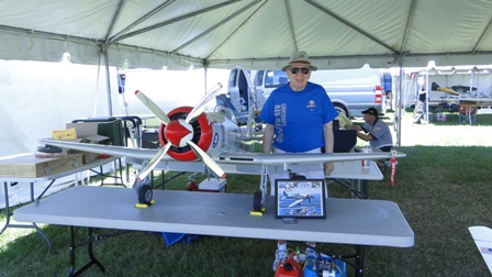 9 Sawbones on display table with a collage picture of Robin Crandall's full scale Sawbones